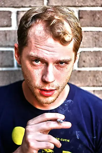 high contrast photo of man with a cigarette