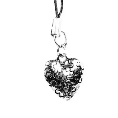 metal puzzle piece pendant in the share of a heart